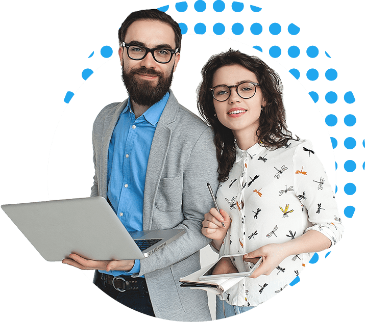 Man and women in business casual atire holding laptop and tablet