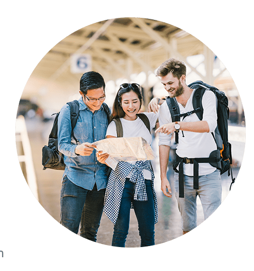 Young travelers looking at map